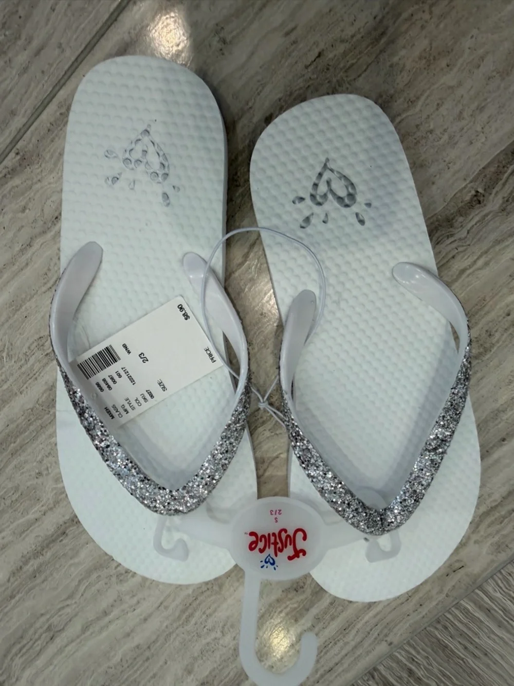 Girls Justice White Flip Flops with Silver Glitter Straps. Size 2/3